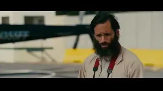 man with beard in front of helicopter — The Dictator