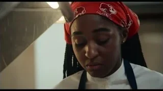 woman in chef uniform in kitchen — The Bear