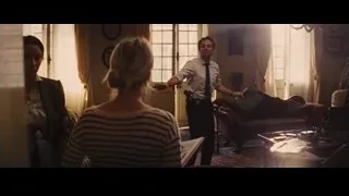 Man speaking to woman in living room — Now You See Me