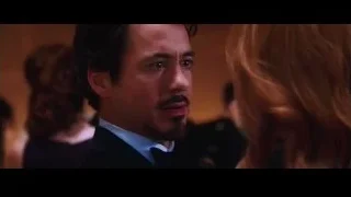 Man and woman embracing in dark room — Iron Man