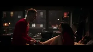 couple in romantic embrace with Christmas tree — Deadpool