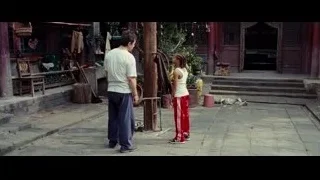 Man and girl with black bird in Chinese courtyard — The Karate Kid
