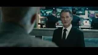 two men discussing blueprint in large room — Furious Seven