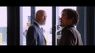 two men looking out large window — Iron Man
