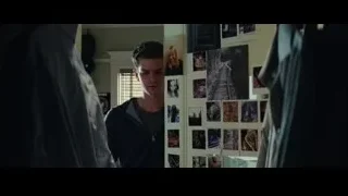 Man in room with wall of photographs — The Amazing Spider Man 2