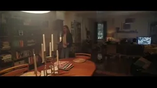 woman holding food in dimly lit living room — Doctor Strange 2