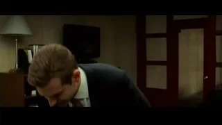 man in suit sitting in office — Limitless