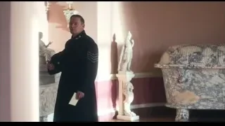 man holding paper in pink room with statues — Peaky Blinders