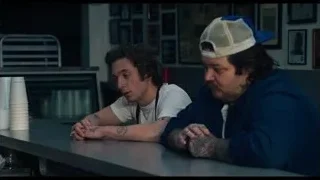 Two men sitting at restaurant counter — The Bear