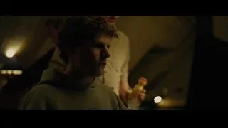 two young men in dimly lit room — The Social Network