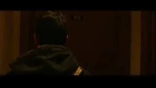 Two people by door 611 in dark room — Whiplash