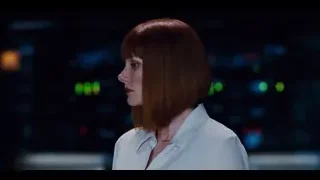 Red-haired woman serious in city skyline — Jurassic World