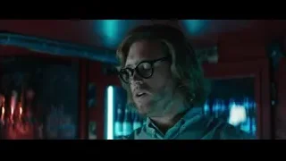 Man with glasses in dimly lit room — Deadpool 2
