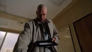 bald man looking at tablet in room — Breaking Bad