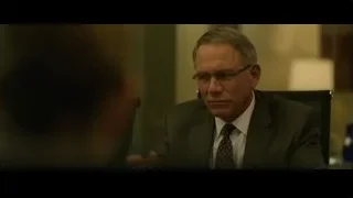 Older man in suit talking seriously — The Social Network