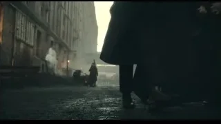 Man walking in industrial alley with old buildings — Peaky Blinders
