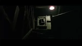 Dark stairway to window with statue — The Matrix