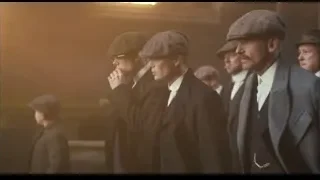 men in suits and hats walking in line — Peaky Blinders
