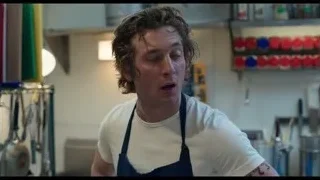young man in apron in kitchen — The Bear