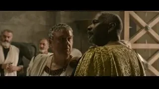 Men in robes standing in stone room — Gladiator 2