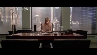 woman reading book at office desk — American Psycho