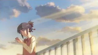 Young girl on balcony looking at red phone — Your Name