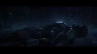 Person lying on ground in dark forest — Iron Man 3