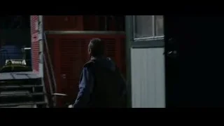 man in dark room with American flag — The Amazing Spider Man
