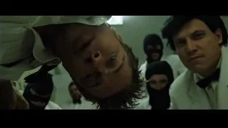 Man surprised with masked people behind him — Fight Club