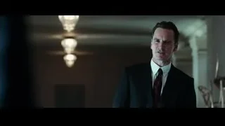 man in suit in dimly lit room — Steve Jobs