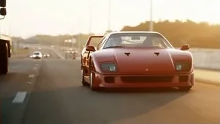 Red sports car driving on highway at sunset — Sports Cars