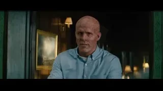 bald man crouching in dimly lit green room — Deadpool 2