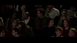 people watching movie in dark theater — Now You See Me 2