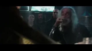 elderly man smoking in dim bar — Deadpool