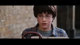 young boy holding steering wheel by brick wall — Harry Potter and the Philosophers Stone
