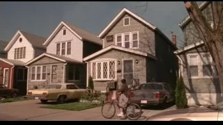 row of houses on a street — Spider Man