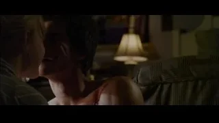 Woman leaning over unconscious man in room — The Amazing Spider Man