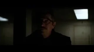 man with glasses and mustache in dark room — Batman: The Dark Knight