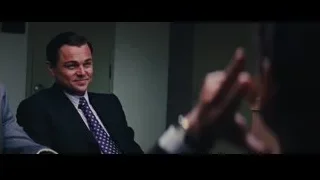 man talking to woman at desk — The Wolf Of Wall Street