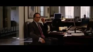 man sitting at office desk — Batman: The Dark Knight