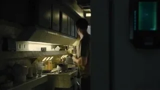 Man cooking in dimly lit kitchen — Blade Runner 2049