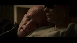 elderly man resting on woman's shoulder — Deadpool