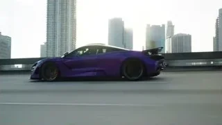 purple sports car driving on city street — Sports Cars