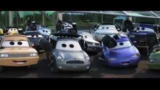 Group of animated cars parked in front of building — Cars 3
