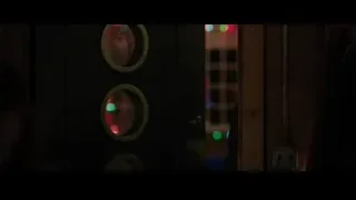 Man in dimly lit room with circular lights — Iron Man 3