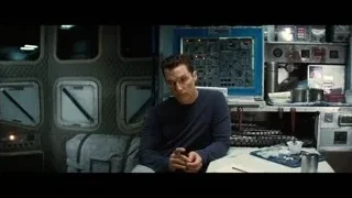man in control room deep in thought — Interstellar