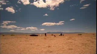 people and cars in desert landscape — Breaking Bad