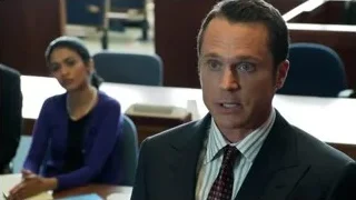 man speaking into microphone in conference room — Suits