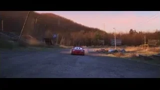 Lightning McQueen driving on dirt road at sunset — Cars 3