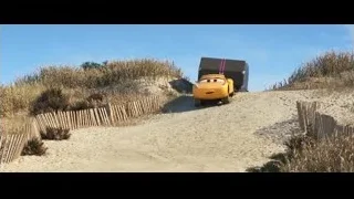 cartoon car driving on sandy path — Cars 3